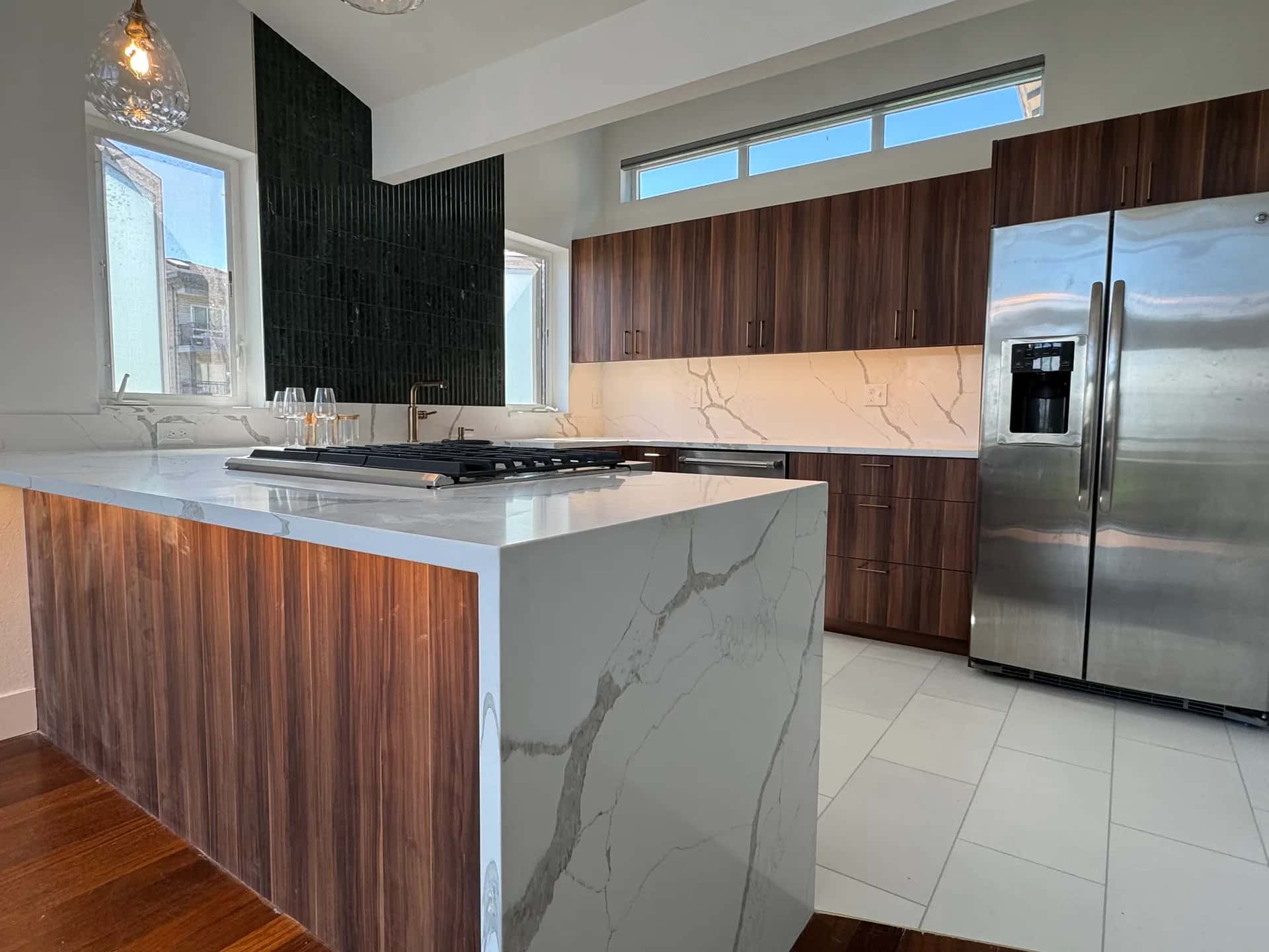Custom kitchen with island and pendant lighting in Seattle, Washington