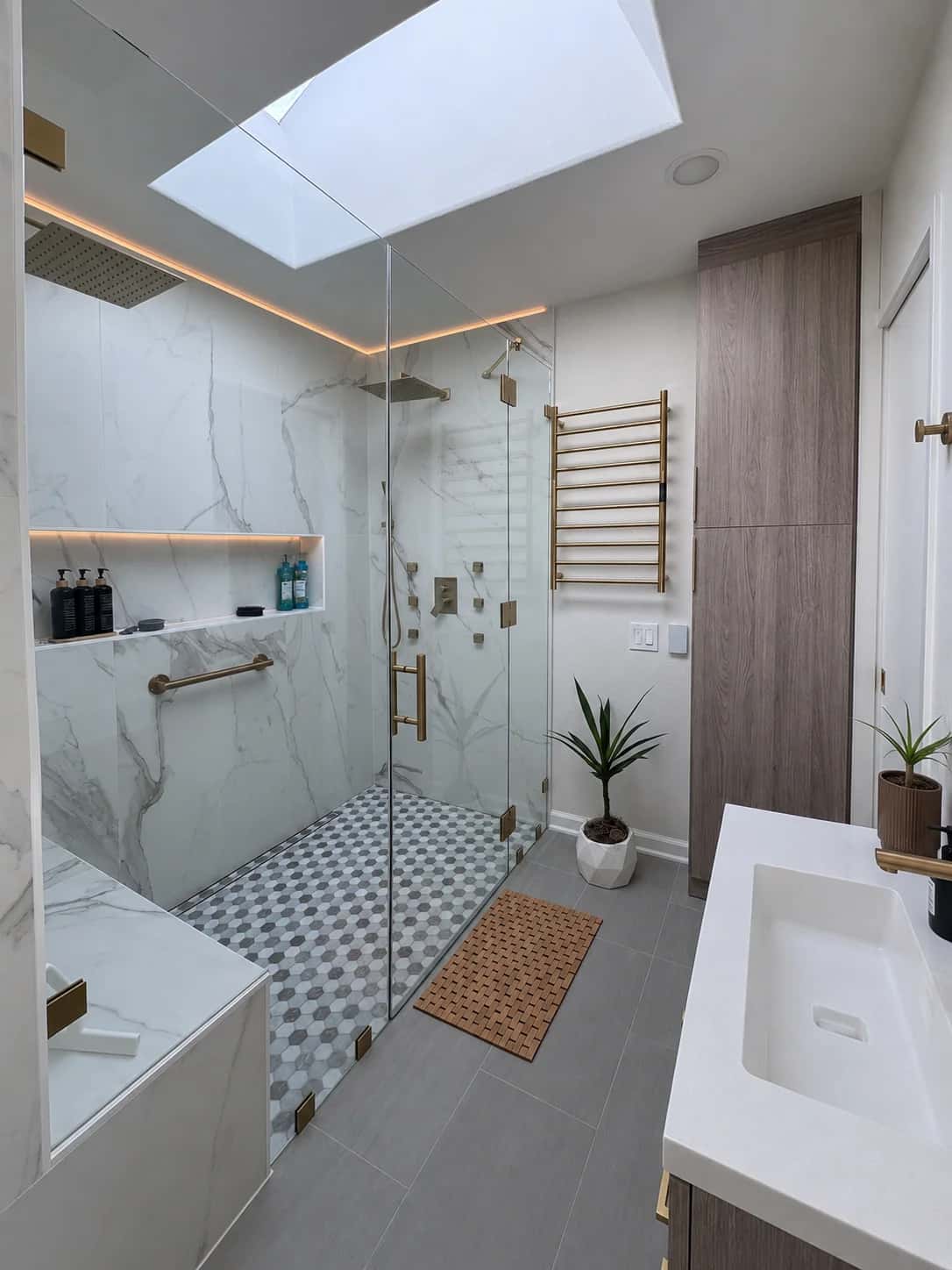 bathroom-skylight-gold-fixtures-heated-towel-rack