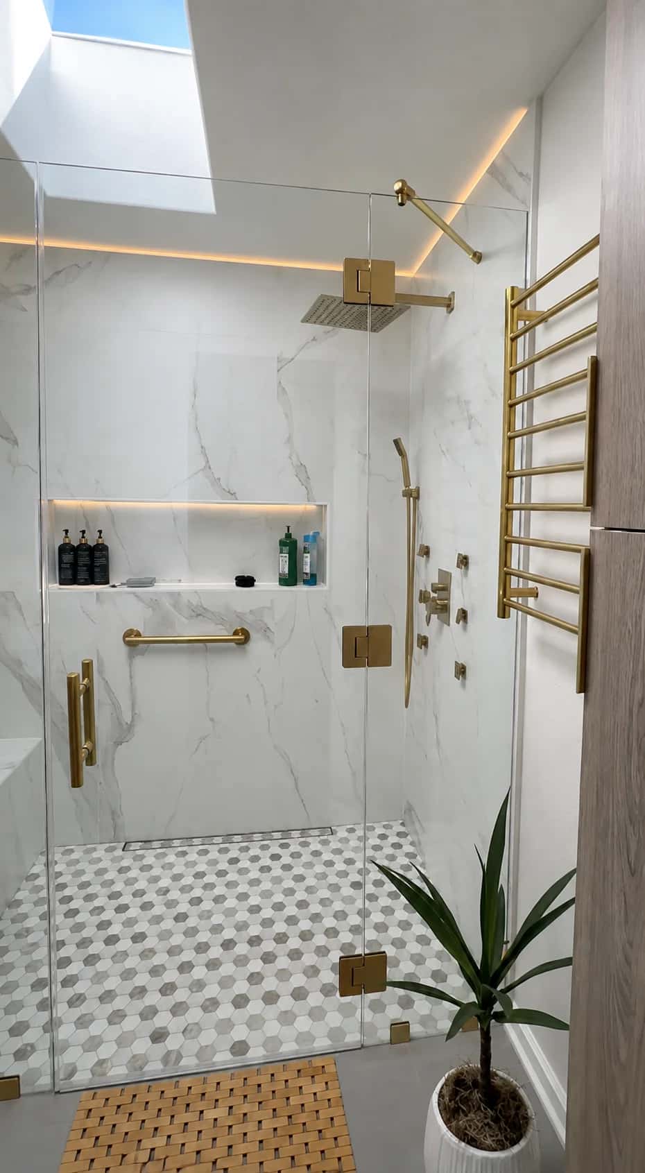 bathroom-skylight-gold-fixtures-heated-towel-rack