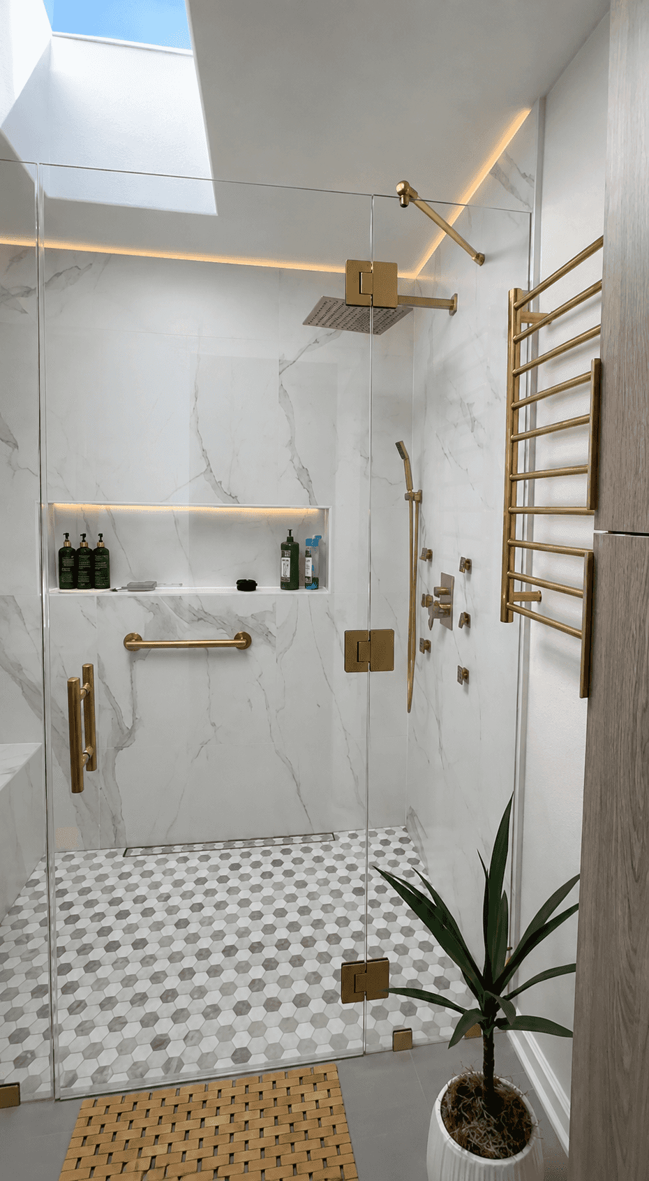 bathroom-skylight-gold-fixtures-heated-towel-rack