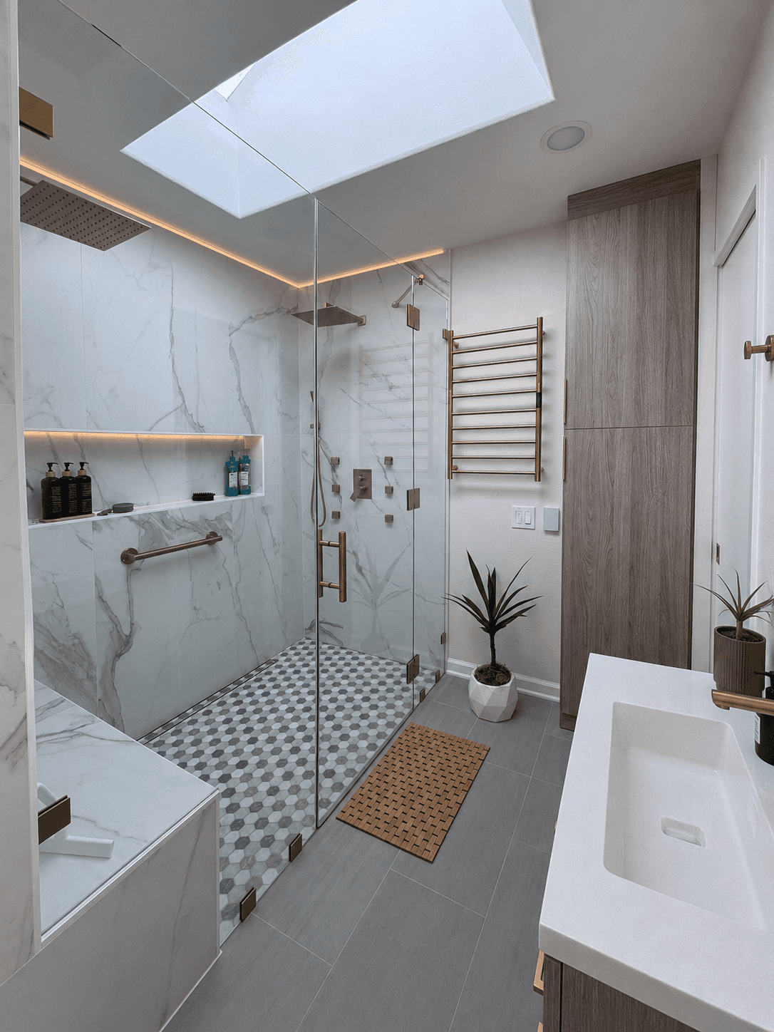 bathroom-skylight-gold-fixtures-heated-towel-rack