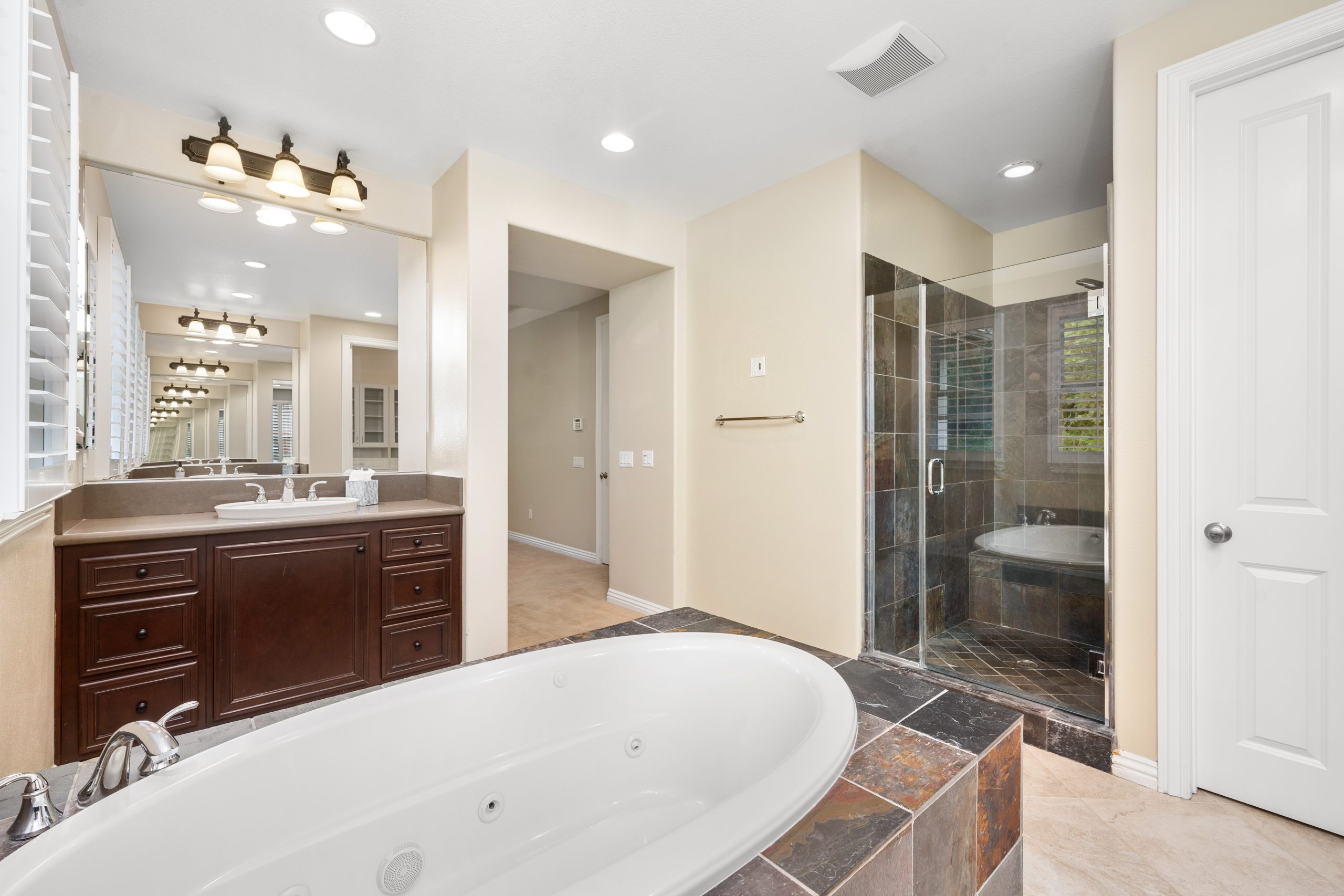 A modern bathroom with tiled floors and a bathtub. California, USA